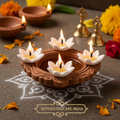 Cotton Phool flower shaped diya wick burning in clay diya lamp Diwali festival celebration - Schoolingcare